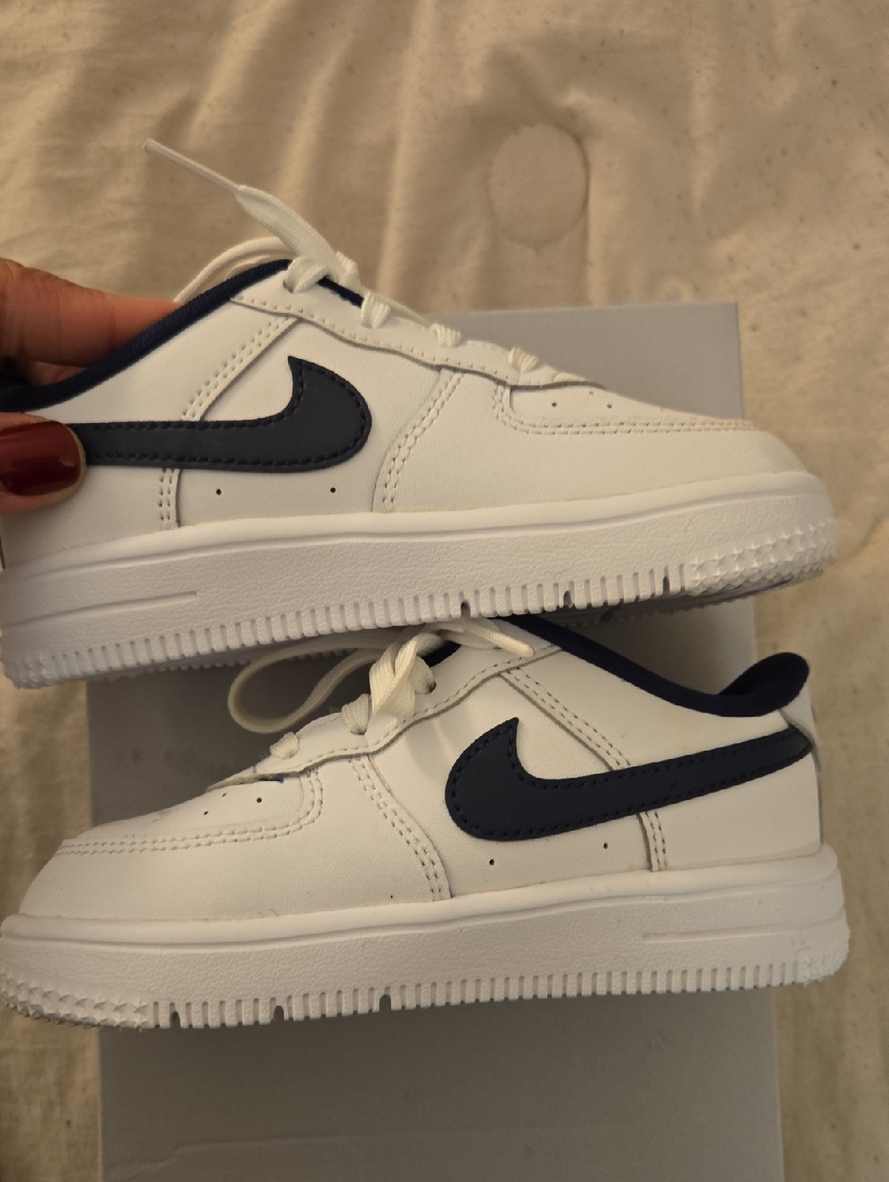 Nike White Low-Top Sneakers with Navy Swoosh